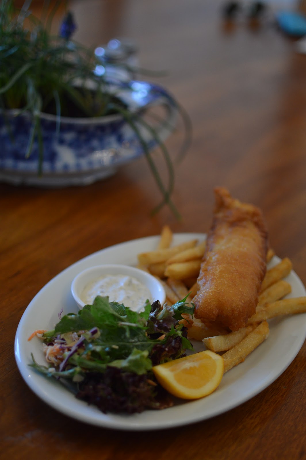 Fish and chips with salad and a wedge of lemon